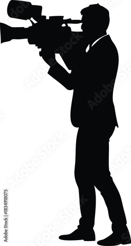 A silhouetted figure operates a large format camera on a dark background