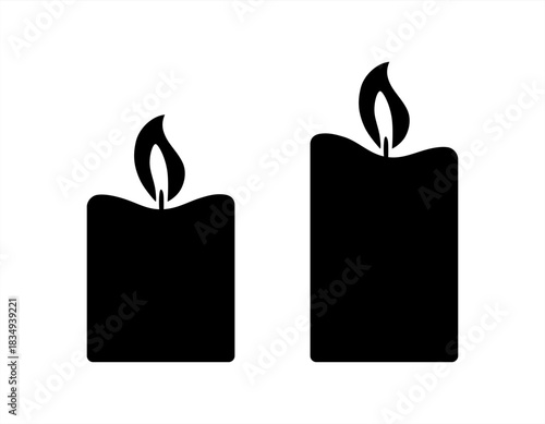 Black silhouette of two burning candles vector icons.