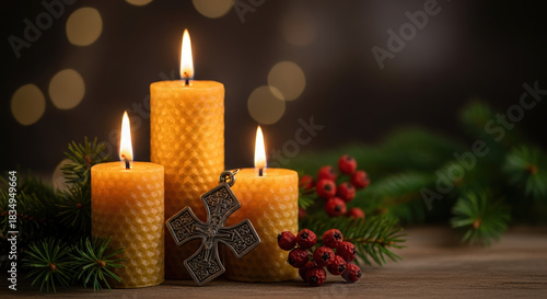 Orthodox Christmas still life features burning wax candles with warm light and a cross decoration. Celebrating Orthodox Christmas,