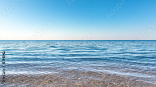 Fototapeta Naklejka Na Ścianę i Meble -  Calm sea horizon blue sky gentle waves peaceful mood
