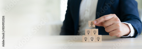 Idea creation and innovative product launching concept. Wooden block  with rocket and idea generation icons. Idea creation, innovation and the launch of a new product from concept to execution.