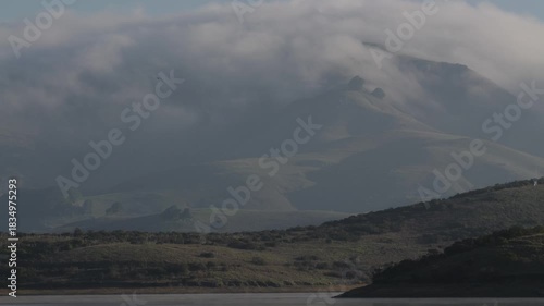 Time-Lapse of Coastal Marine Fog Spilling Over California Mountains and Oak Trees