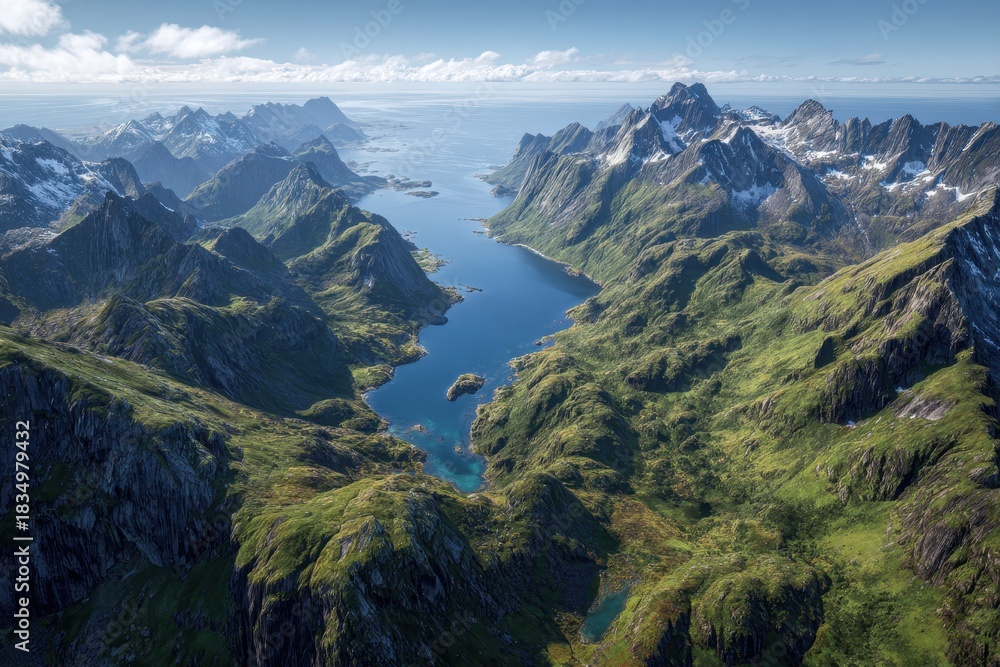 Obraz premium Breathtaking aerial view of Flakstadoya mountains revealing stunning landscapes of Lofoten Islands with lush greenery and serene waterway at midday