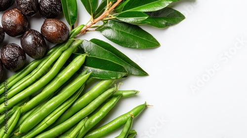Fresh Green Beans Black Olives and Olive Branch on White Surface