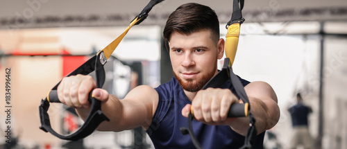 Handsome muscular man exerc...