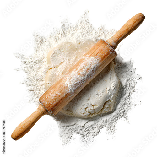 Wooden rolling pin resting on a mound of flour and dough
