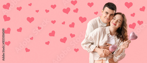 Happy young couple with hea...