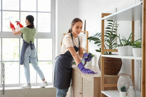 Female janitor cleaning com...
