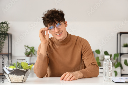 Young man video chatting at...