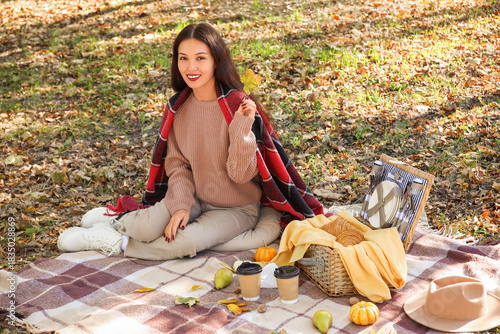Young happy Asian woman wit...