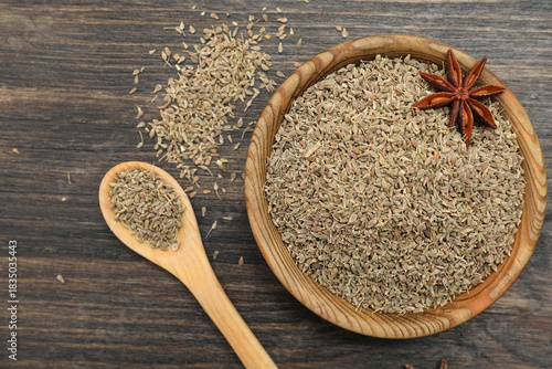 Dried anise seeds in wooden...