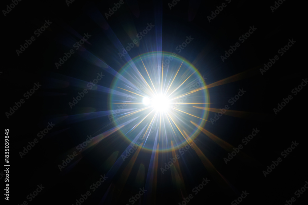 Obraz premium Lens Flare. Light over black background. Easy to add overlay or screen filter over photos. Abstract sun burst with digital lens flare background. Gleams rounded and hexagonal shapes, rainbow halo.