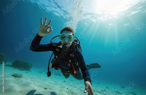 Wallpaper Mural Happy scuba diver smiles underwater in turquoise Mexican sea. Explorer enjoys tropical dive near reef with clear water and sunlight. This image represents ocean adventure and marine biodiversity. Torontodigital.ca