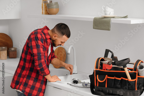 Male plumber with wire clea...