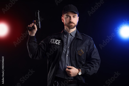 Male police officer with gu...