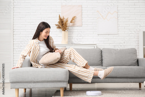 Young woman in pajamas with...