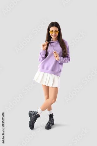 Smiling stylish young woman...