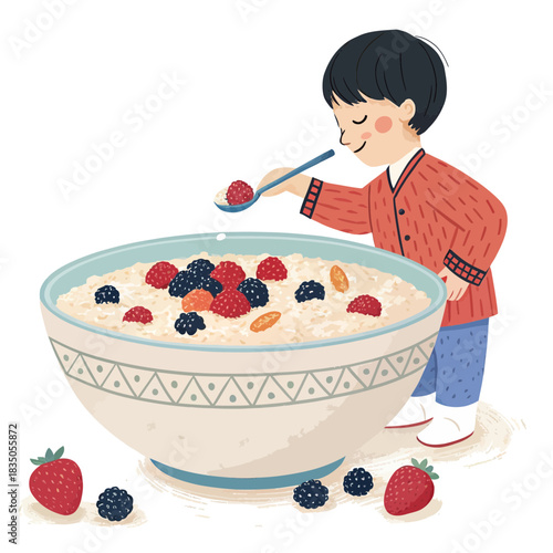 Young boy happily eating a bowl of porridge with berries