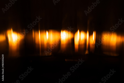 Lens Flare. Light over black background. Easy to add overlay or screen filter over photos. Abstract sun burst with digital lens flare background. Gleams rounded and hexagonal shapes.