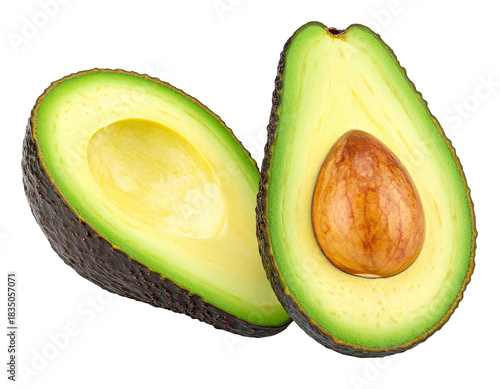 Sliced avocado halves, one with pit, on black