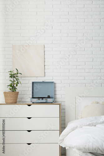 Interior of light bedroom w...