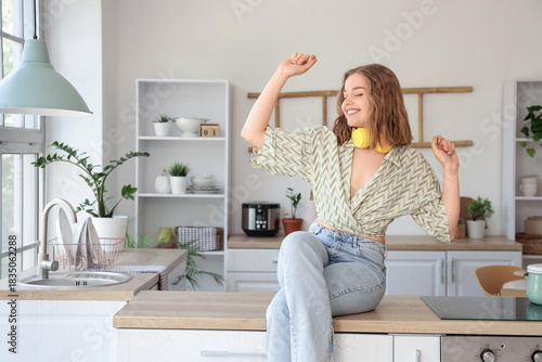 Cool young woman listening ...