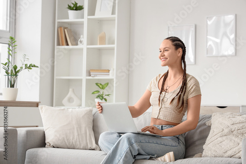 Young woman with dreadlocks...