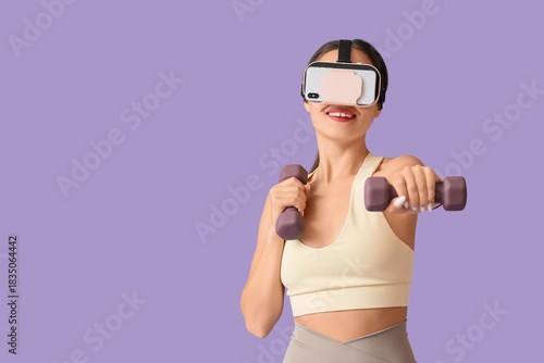 Sporty young woman in VR gl...