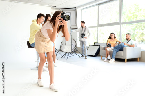Female photographer with ca...