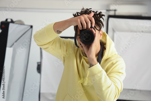 Young male photographer tak...