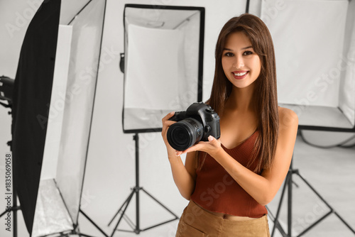 Smiling young female photog...