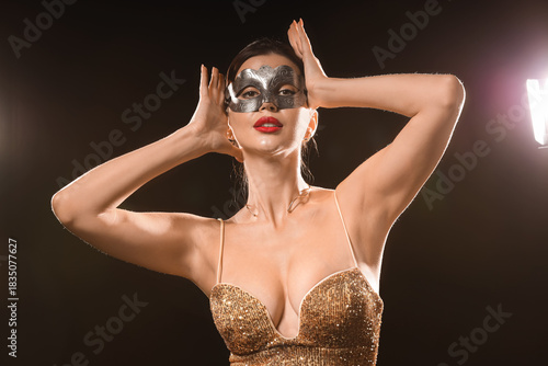 Pretty young woman in golde...