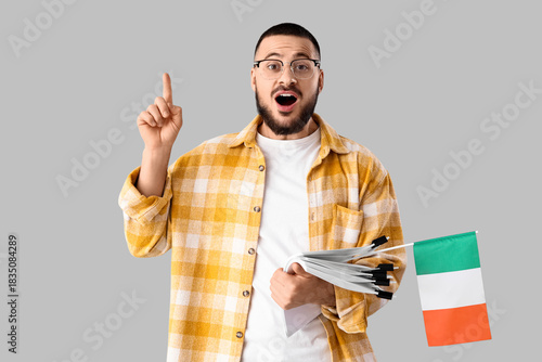 Young man with papers and f...