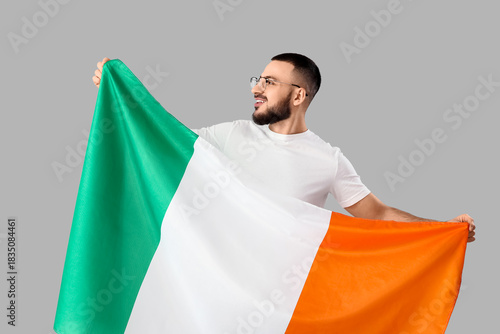 Young man with flag of Irel...