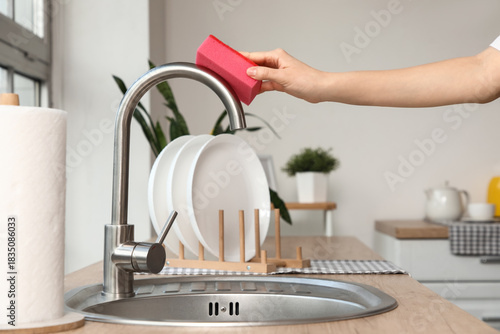 Woman hand cleaning stainle...