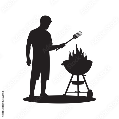 Black Silhouette of a Man Grilling Food Over Hot Flames on a BBQ. 