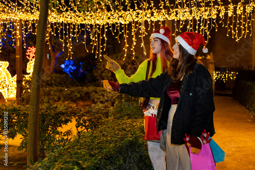 Gen z women friends christmas shopping in valencia