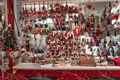 Colorful nutcrackers,  dwarfs, Christmas balls and other festive gifts and ornaments for sale at traditional Christmas market in Strasbourg, France.