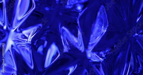 Blue Glass Refraction. Macro abstract of deep cobalt blue crystal glass with flowing light refractions and highlights.