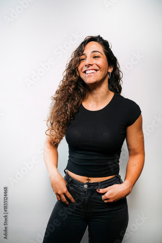 Happy young woman smiling feeling cheerful and confident