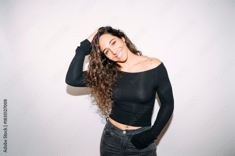 Fototapeta premium Happy young adult woman posing with confidence