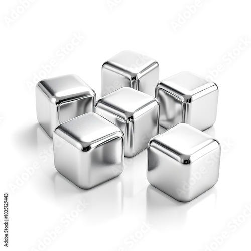A close up of six metal ice cubes arranged on a white surface with soft shadows and reflections
