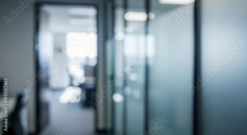 Defocused Modern Office Background Featuring Blurred Door and Glass Partition