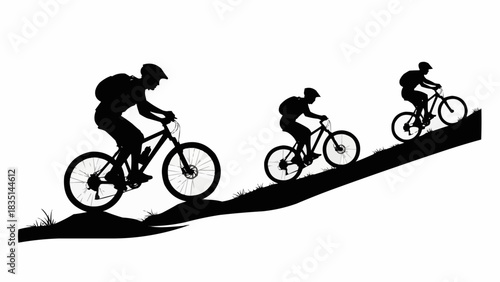 Silhouettes of mountain bikers riding downhill on a grassy slope.
