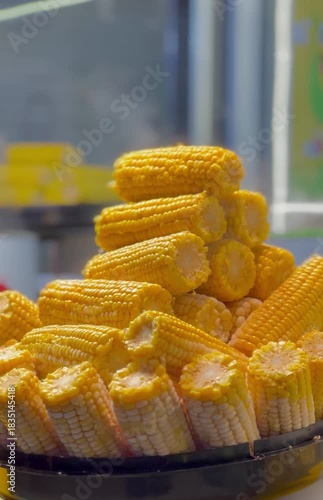 Hot boiled corn with steam rising on the street

