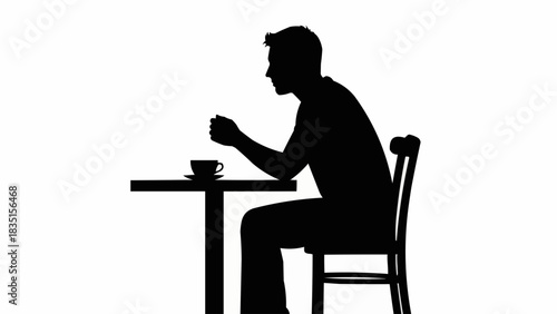 Silhouette of a Man Sitting at a Table with a Cup.