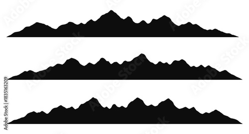 Silhouette mountain ridges with organic uneven peaks stretching in long natural contours