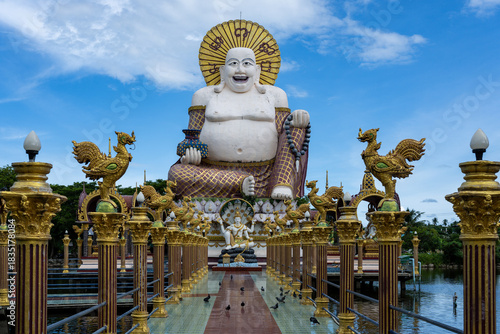 Smiling Buddha statue at Wat Plai Laem temple in Koh Samui, Thailand