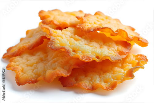 Crispy golden fried pasta chips piled on a white background