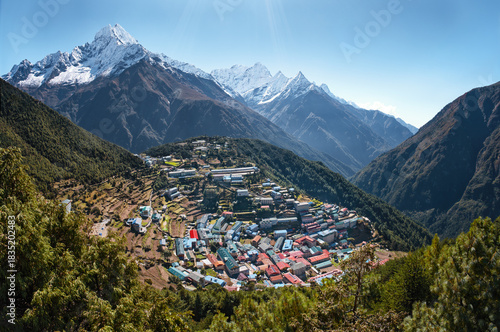 Panoramic View of iconic high-altitude Namche Bazaar. Unique amphitheater-shaped settlement nestled amidst majestic, snow-capped Himalayan peaks in Khumbu region of Nepal.